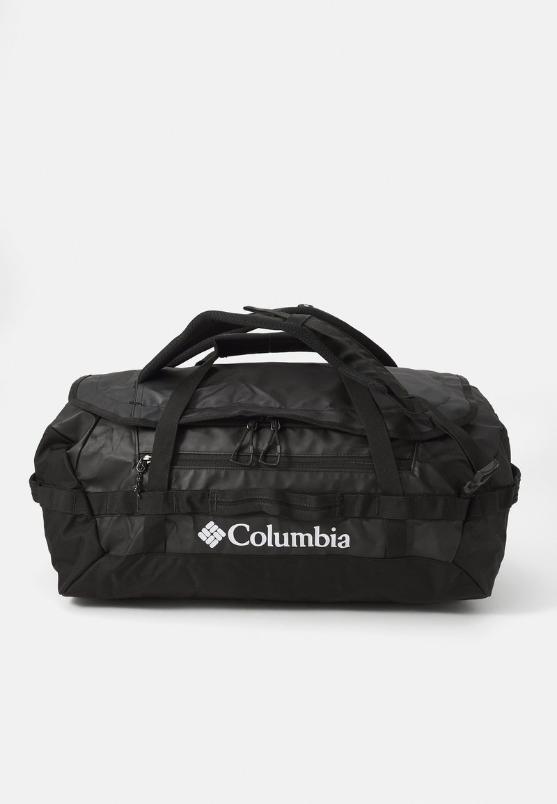 Must must või teker rihmadega, polsterdatud käepidemetega ja kahe tõmblukuga. Valmistatud vastupidavast kangast, küljes Columbia logo.
