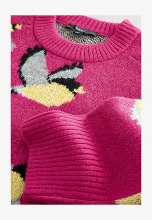 Pink knitted sweater with ribbed crew neckline. Features bird motifs in gray, yellow, and black. Soft texture with a cozy appearance.