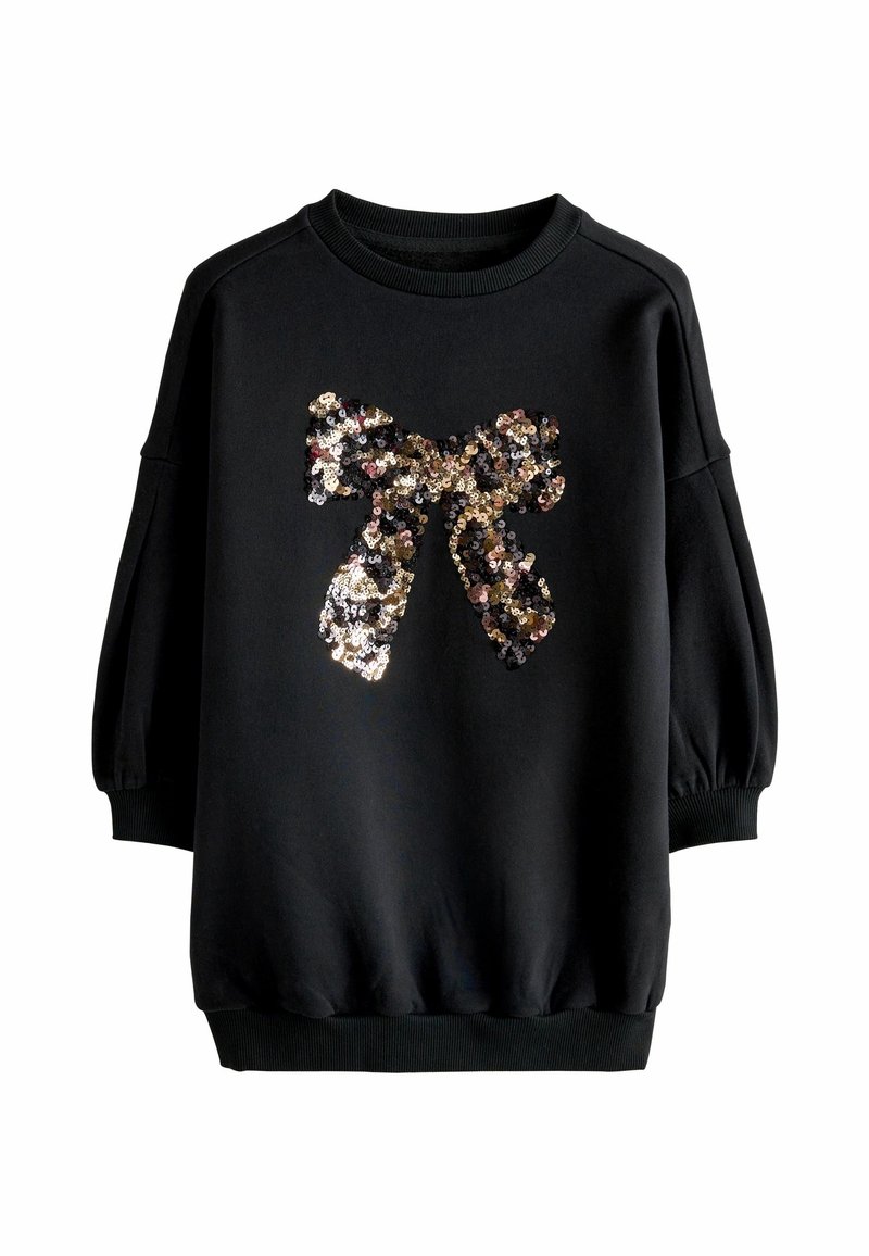Sweatshirt noir à manches longues avec poignets et ourlet côtelés, arborant un grand nœud en sequins brillants sur le devant.
