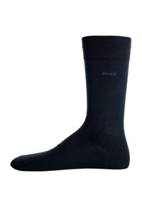 Schwarze Baumwollsocke mit geripptem Bündchen und dezentem "BOSS"-Logo. Glatte Textur mit einem klassischen Crew-Länge-Design.