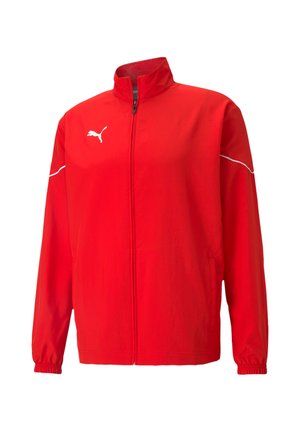 Giacca rossa Puma con colletto alto, zip completa, polsini elasticizzati e strisce bianche di accento sulle spalle. Realizzata in tessuto leggero.
