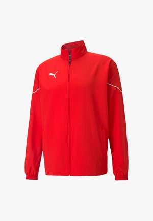 Rote Puma-Jacke mit hohem Kragen, durchgehendem Reißverschluss, elastischen Bündchen und weißen Akzentstreifen auf den Schultern. Hergestellt aus leichtem Material.