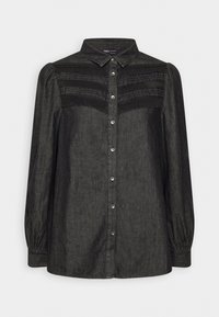 Blouse noire à manches longues pour femme, avec boutonnage devant, dentelle et détails plissés sur la poitrine, et col pointu.