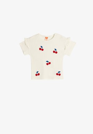 Cremefarbenes T-Shirt mit kurzen Ärmeln, bestickt mit roten Kirschen und blauen Stielen. Verfügt über voluminöse Ärmel und einen runden Ausschnitt. Weiches Material.