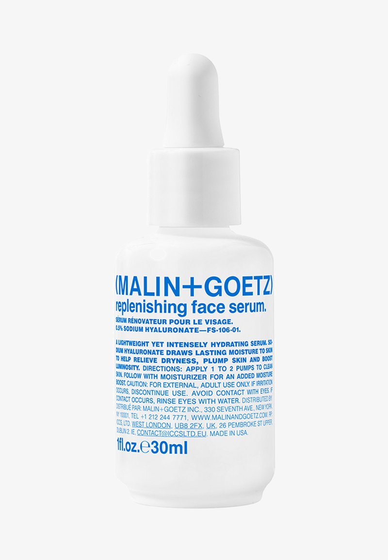 Weißes Glas-Tropffläschchen mit blauer Schrift. Etiketten geben "reparierendes Gesichtsserum" und die Inhaltsstoffe an. Schraubkappe mit Pipette zum Dosieren.