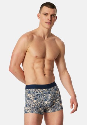 Boxer da uomo in una combinazione di colori crema e navy. Presentano un motivo floreale decorativo, una texture liscia e una fascia elastica larga in vita.
