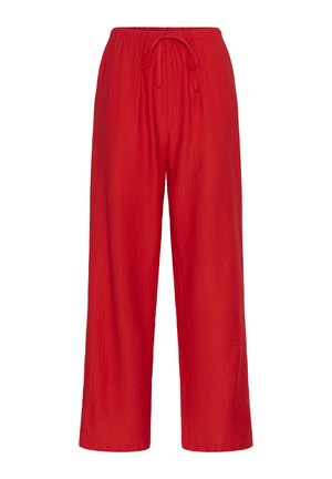 Červené, ľahké nohavice s širokými nohavicami vyrobené z textúrovanej látky s elastickým pásom a šnúrkou na stiahnutie. Žiadne vrecká nie sú viditeľné.