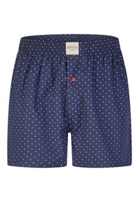 Boxers pour hommes bleu marine à pois blancs, bouton rouge sur le devant, et étiquette "Phil & Co." sur la ceinture élastique.