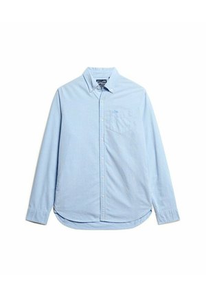 Lichtblauw button-up shirt van zachte katoen. Kenmerkt zich door een kraag, lange mouwen en een borstzak met een subtiele logo. Afgeronde zoom.