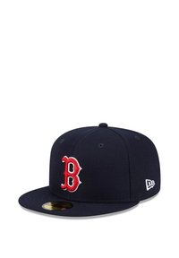 Navy blue baseball cap with red embroidered "B" logo. Flat brim design, structured crown, and soft fabric texture. Right side features logo patch.