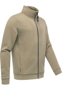 Felpa beige con zip, colletto alto, maniche lunghe e texture morbida. Dotata di tasche laterali e zip a contrasto.