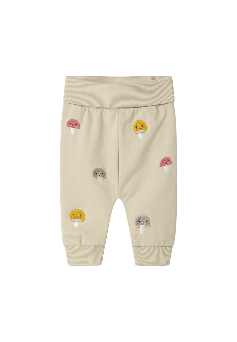 Beige Kinderhose mit geripptem Bund und Bündchen, verziert mit gestickten lächelnden Pilzen in Gelb, Rosa und Grau.