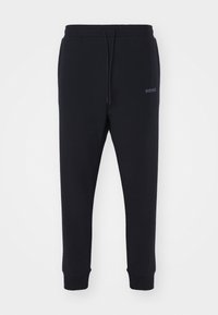 HADIKO - Tracksuit bottoms - black