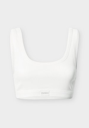 Balts ribots bralets ar kvadrātveida izgriezumu un platām lencēm. Apakšējā joslā ir logotipa uzlīme. Izgatavots no elastīga auduma.