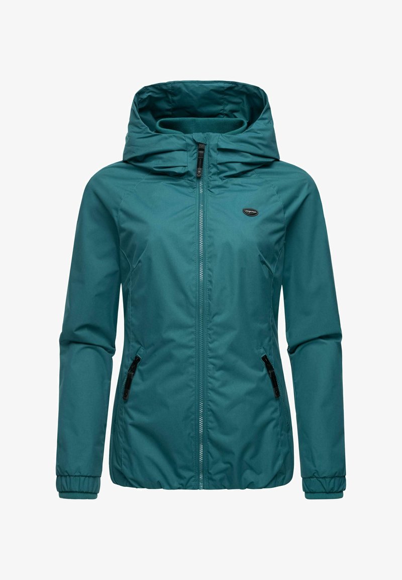 Tamsiai mėlyna vandeniui atspari striukė su užtrauktuku priekyje, reguliuojamu gobtuvu, elastingomis rankovėmis ir dviem šoninėmis kišenėmis su užtrauktukais. Lygus tekstūros paviršius.