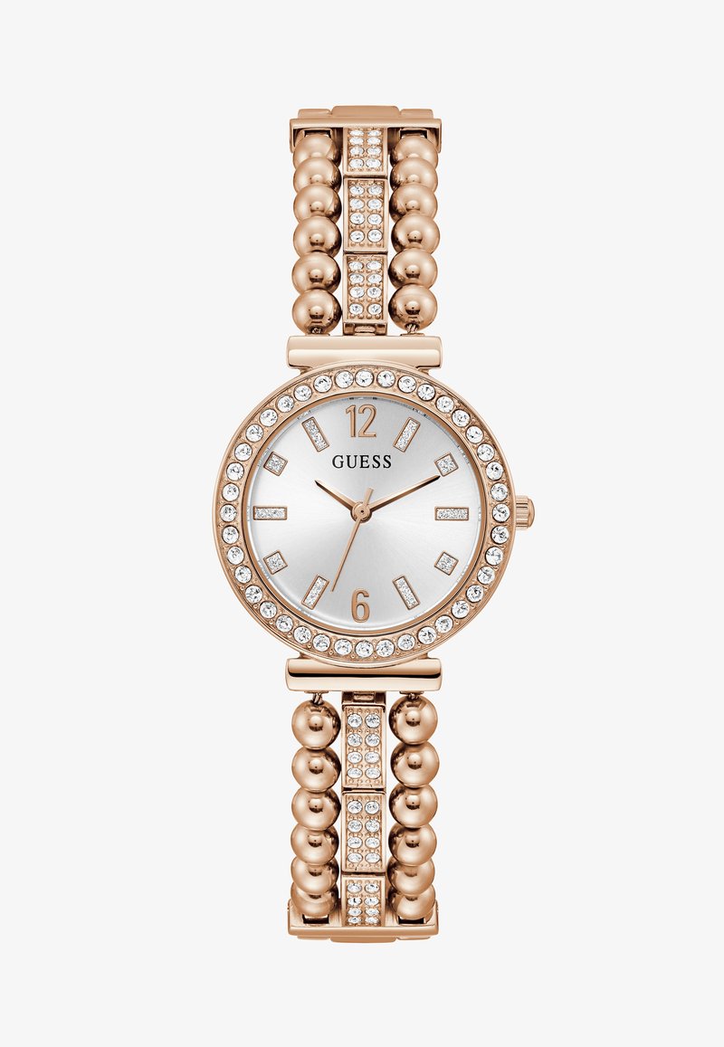 Roosa kuldne kell ümmarguse kellaplaadi, hõbeda näo, kristallaktsentide ja helme tekstuuriga rihmaga, mis sisaldab ristkülikukujulisi linke ja täiendavaid kristallidetaile.