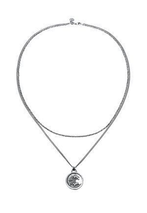 Silver double-strand necklace featuring a round pendant with a wave design, showcasing a textured surface and a clasp closure.