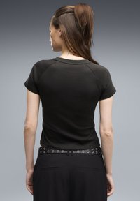Puma PUMA SPORT SLIM GRAPHIC TEE - Μπλουζάκι με στάμπα - puma black