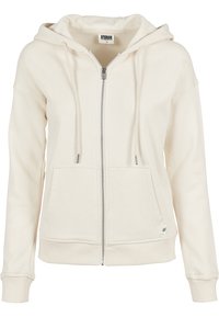 Sweat à capuche crème zippé avec poches avant, cordon de serrage à la capuche, poignets et ourlet côtelés, étiquette Urban Classics taille small.