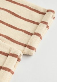 Beige fabric with textured stripes in brown. Visible rolled hem detail, emphasizing the soft, woven nature of the material.