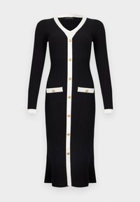 Μακρύ μαύρο πλεκτό φόρεμα με ριμπ ύφανση, λευκή επένδυση, χρυσά κουμπιά μπροστά και δύο τσέπες μπροστά, με μακριά μανίκια και V-λαιμόκοψη.