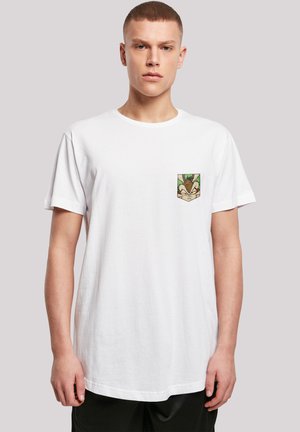White cotton t-shirt featuring a colorful printed patch on the left chest depicting a character with a leaf motif. Short sleeves.