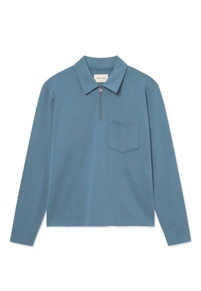 Blue long-sleeve polo shirt with a quarter zip and a chest pocket, displayed flat on a white background.