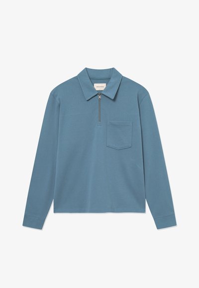 Blue long-sleeve polo shirt with a quarter zip and a chest pocket, displayed flat on a white background.