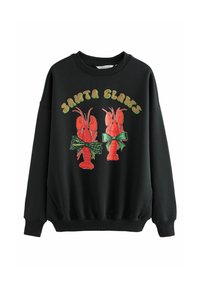 Czarna bluza z dwiema czerwonymi homarami z zielonymi kokardami, ozdobiona tekstem "Santa Claws" w błyszczących, wielokolorowych literach.