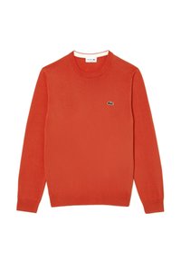 Czerwona bluza z długim rękawem i okrągłym dekoltem, z prążkowanymi mankietami i dołem, z małym zielonym logo krokodyla na lewej piersi.