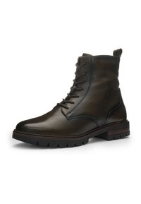 Mørkebrun læder støvle med snørebånd, rå sort sål og trækstrop bagpå, vinklet for at vise detaljer fra siden og fronten.