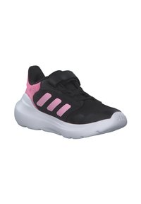Black athletic shoe with pink mesh accents, featuring three pink stripes on the side, a velcro strap, and a white cushioned sole.