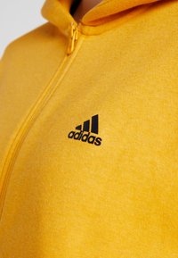 adidas Performance Felpa con zip - gold-coloured