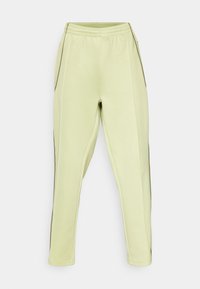 Light green jogger pants made of soft material, featuring an elastic waistband, side pockets, and dark side accents for contrast.