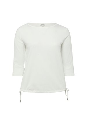 Witte dames top met lange mouwen, ronde hals en verstelbare trekkoorden aan de zoom, weergegeven op een effen achtergrond.