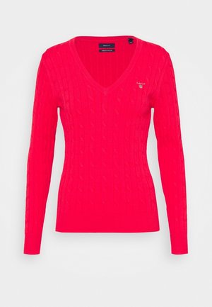 Red cable-knit V-neck long-sleeve sweater with ribbed cuffs and hem, featuring a small GANT logo on the left chest.