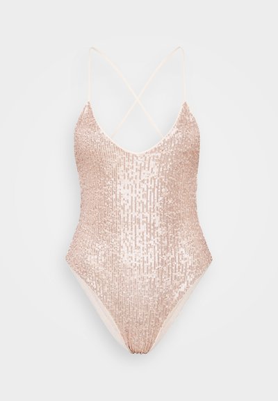 One-piece swimsuit in light pink with a shimmering sequin texture, featuring a V-neck and crisscross straps at the back.