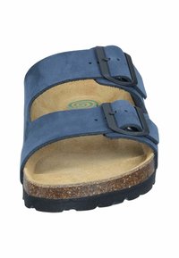 Navy blue suede slide sandal with two adjustable black buckles, natural cork footbed, and textured black rubber sole. Round logo on insole.