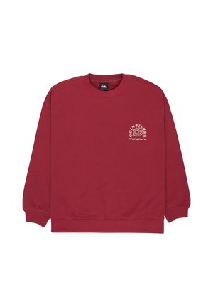 Czerwona bluza z długim rękawem i okrągłym dekoltem. Na lewej stronie klatki piersiowej znajduje się biały nadruk. Wykonana z miękkiego materiału.