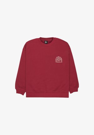 Sweat-shirt rouge avec col rond et manches longues. Présente un motif blanc sur la partie gauche de la poitrine. Fabriqué dans un matériau doux.