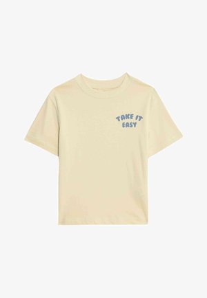 Light beige cotton t-shirt with short sleeves, featuring the text "TAKE IT EASY" in a curved blue font on the left chest area.