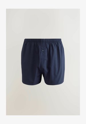 Tumesinine puuvillane bokserisärgiga, millel on elastne vöökoht, üks eesmine nupp ja sile, kerge tekstuur.