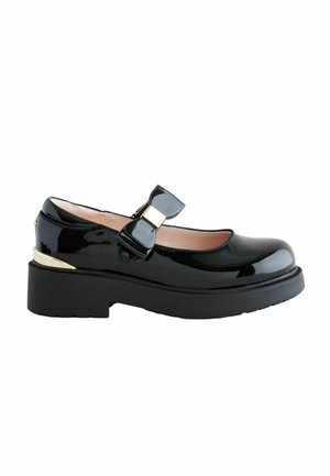 Schwarze lackierte Mary Jane-Schuhe mit einer abgerundeten Spitze, einer dekorativen Schleife und einer dicken schwarzen Plateausohle. Goldener Akzent in der Nähe der Ferse.