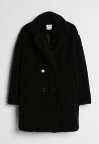 Manteau noir à double boutonnage en matériau duveteux et texturé, avec deux poches avant et large col à revers. Présente des boutons noirs.