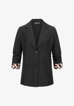 Czarna marynarka z klapą z wycięciem, z dwoma przednimi kieszeniami i w panterkę wykończonymi podwiniętymi mankietami. Zapięcie na pięć guzików.
