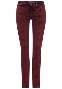 Jeans skinny burdeos hechos de mezclilla, con diseño de cinco bolsillos, lazos para cinturón y costuras frontales detalladas.