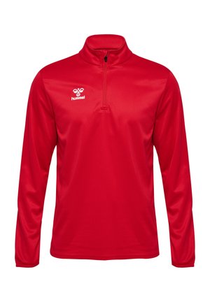 Rød langærmet top med høj krave og kvart lynlås. Fremstillet af glat stof med en subtil glans. Hummel-logo placeret på brystet.