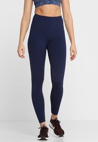 Marinblå högmidjade tights tillverkade av stretchigt material, med en slät yta, ankellång design och inga synliga mönster.