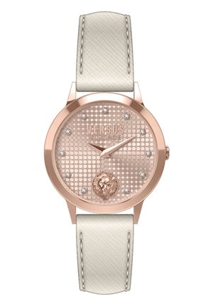 Rose gold watch with a textured pink dial, featuring a lion emblem, crystal accents, and a white leather strap.