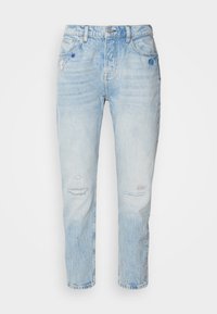 Lyseblå falmede denimjeans med høy midje, frontlås og glidelås, fem lommer, og subtile slitte og lapper detaljer.
